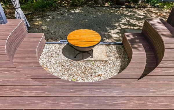 Deck built in a c-shape around fire pit